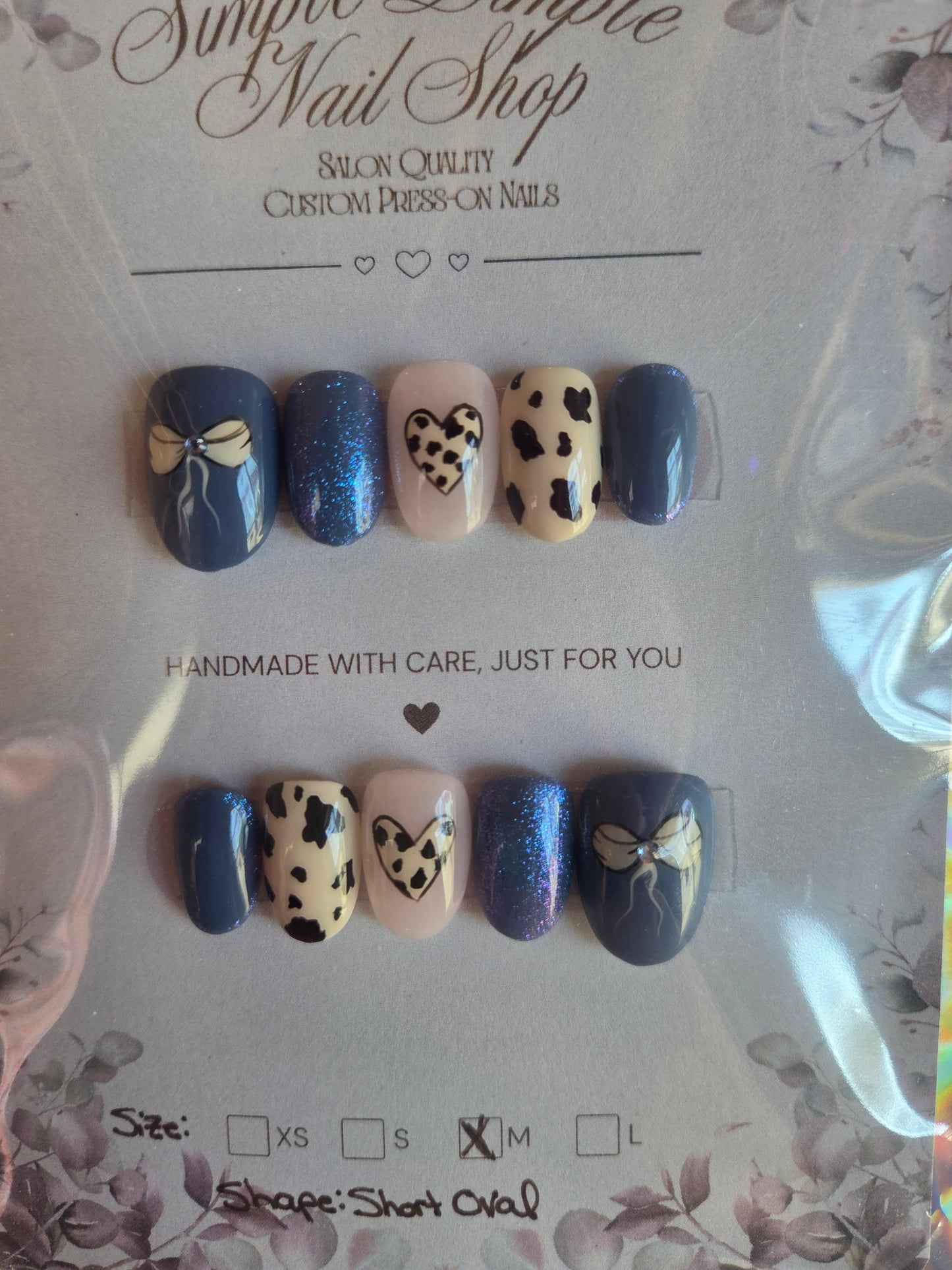 M Short Oval Blue Cowprint